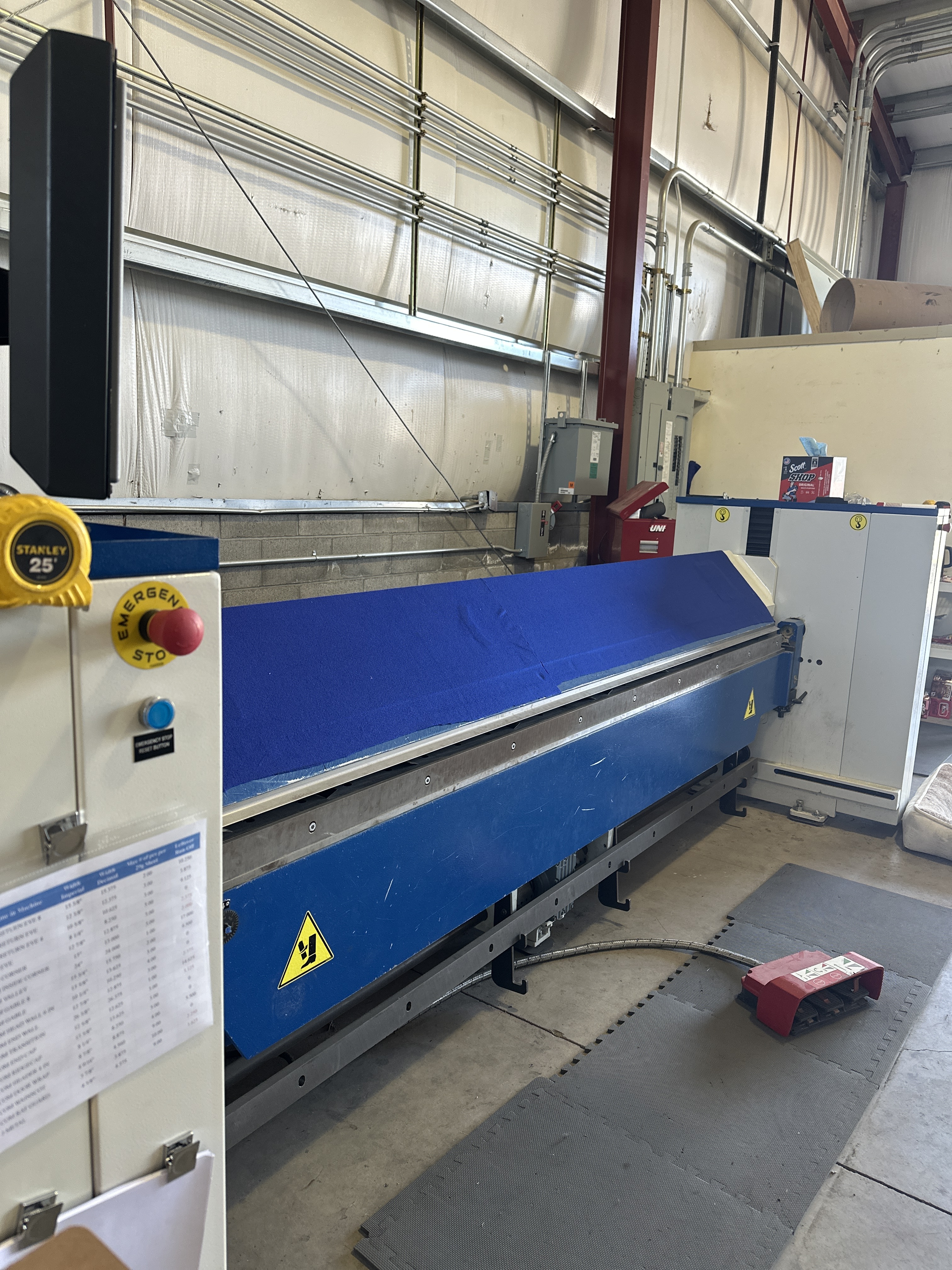 Metal roofing panels on building